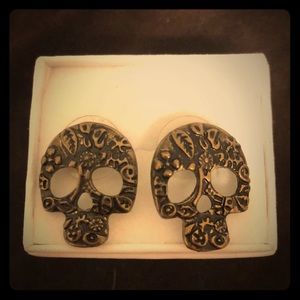 Gold plated sugar skull earrings.